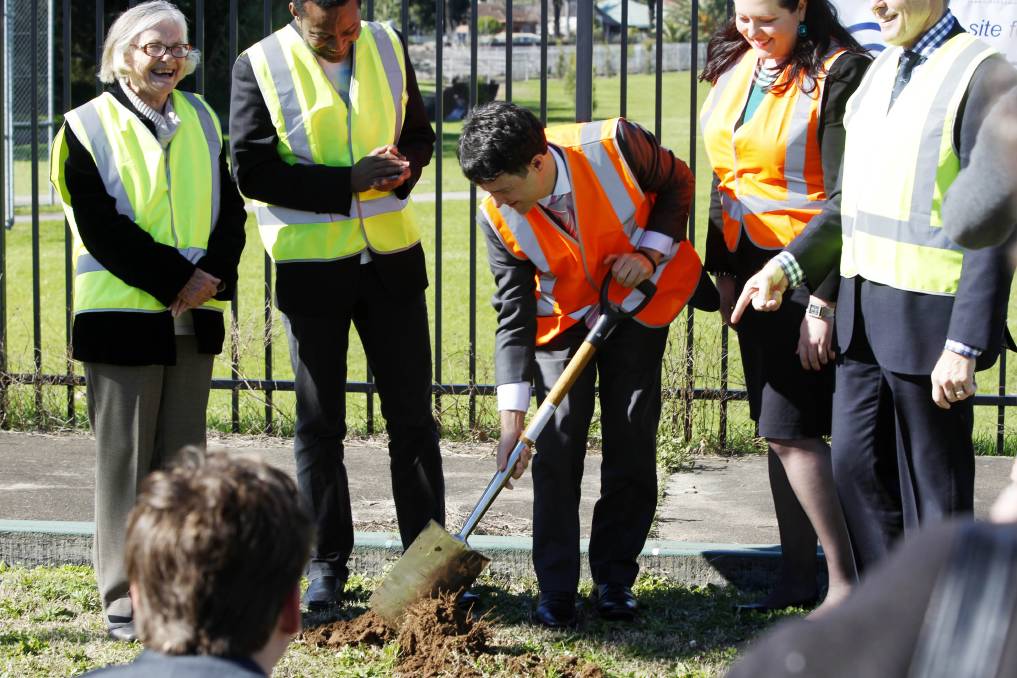  Victor Dominello turns the first sod. Photo: Newcastle Herald